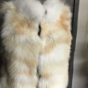 A Kit Fox vest with white Fox Collar